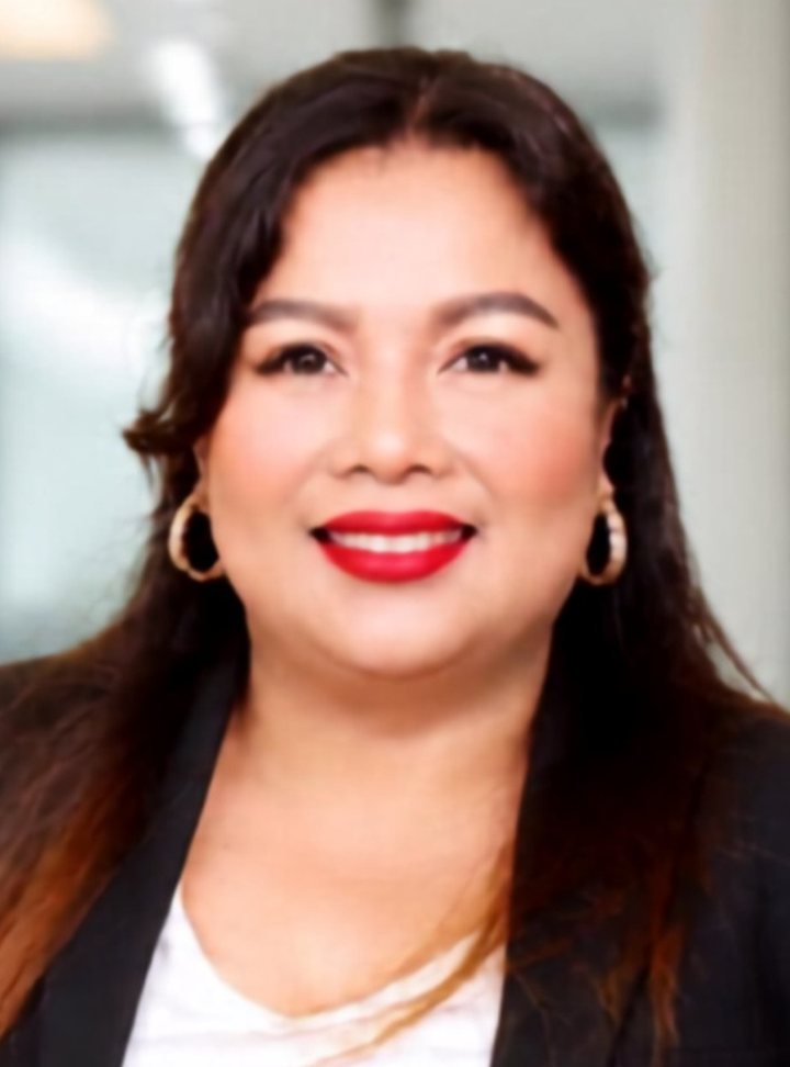 Bella Gonzaga smiling in a black blazer